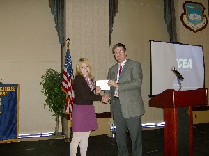 Candace Caveny of O'Fallon Township High School recieves a $1,000 Teaching Tools Award from Mike Bradfield, chapter award coordinator.